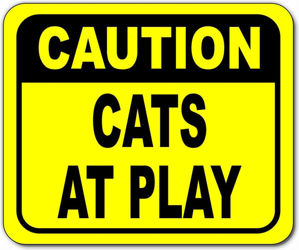 Caution cats at play Bright yellow metal outdoor sign