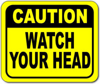 Caution watch your head low overhead Bright yellow metal outdoor sign