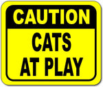 Caution cats at play Bright yellow metal outdoor sign