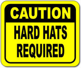 Caution hardhats required Bright yellow metal outdoor sign